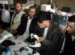 Students at the Kapisa Agriculture Institute receive instruction from the Kentucky National Guard's third Agribusiness Development Team Aug. 12, 2011.