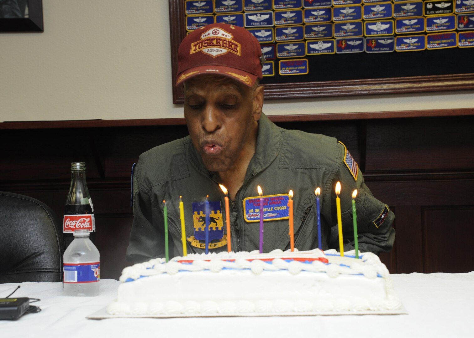 Dr. Granville Coggs, documented original Tuskegee Airman, blows out the candles on his 90th birthday cake during a celebration with the 99th Flying Training Squadron July 30 at Joint Base San Antonio-Randolph. As well as serving as one of the Tuskegee Airmen, Coggs worked for 30 years as a diagnostic radiologist focusing on breast cancer detection. Coggs currently lives in San Antonio with his wife, Maud. 