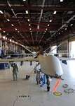 Members of the 174th Fighter Wing Maintenance Group prepare a MQ-9 Reaper for its initial taxi at Wheeler-Sack Army Air Field at Ft. Drum, N.Y., on June 30, 2011. The pre-taxi activity took place in temporary hanger space provided by the U.S. Army's 10th Mountain Division. This milestone represented the unit's first step toward flying the MQ-9 from its detachment at Ft. Drum. The wing is based at Hancock Field in Syracuse, New York.