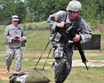 Army Sgt. James Nelson, 50th Brigade Special Troop Battalion, New Jersey National Guard, pulls a 125 pound medical stretcher about 30 yards during an timed evaluation as part of the Army National Guard's Best Warrior Competition in Fort Benning, Ga. Aug. 6, 2011. Nelson was one of seven Army Guard members who competed for the title of Soldier of the Year throughout the five days of competition which began Aug. 4, 2011.