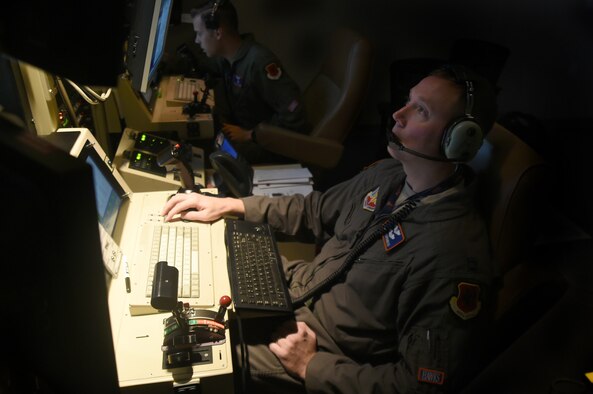 Staff Sgt. Lloyd (left), an 18th Reconnaissance Squadron MQ-1B Predator sensor operator, and Capt. Benjamin, an 18th RS Predator pilot, fly a remotely piloted aircraft training sortie in support of Red Flag 15-3 at Creech Air Force Base, Nev., July 23, 2015. The goal of participating in Red Flag exercises was to fully integrate RPAs into large force exercises and to educate other major weapon systems communities on the RPA capabilities. (U.S. Air Force photo/Tech. Sgt. Nadine Barclay)