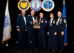 Air Force Staff Sgt. John Norris, a tactical air control party member assigned to the 193rd Special Operations Wing, Pennsylvania National Guard, is named Air National Guard Noncommissioned Officer of the Year for 2011. The award was presented at the Outstanding Soldiers and Airmen of the Year banquet in Arlington, Va., Aug. 12, 2011. Presenting the award are (left to right) Air Force Gen. Craig McKinley, chief of the National Guard Bureau; Air Force Lt.Gen. Harry Wyatt , director of the Air National Guard; Air Force Chief Master Sgt. Denise Jelinski-Hall, senior enlisted advisor to the chief of the National Guard Bureau, and Air National Guard Command Chief Master Sgt. Christopher Muncy.