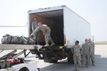 167th Theater Sustainment Command personnel unload airplanes at the Aerial
Port of Debarkation at during training exercise Vibrant Response 12.1 at Camp
Atterbury, Ind., Aug. 20, 2011.