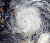 A GOES-13 infrared satellite image provided by the U.S. Naval Research Laboratory, Monterey, Calif., shows the status of Hurricane Irene at about 6 a.m. EDT, Aug. 24, 2011. Irene crossed over the Bahamas with 115-mph winds. The storm could strike the U.S. East Coast between Florida and the Carolinas as a Category 3 hurricane.