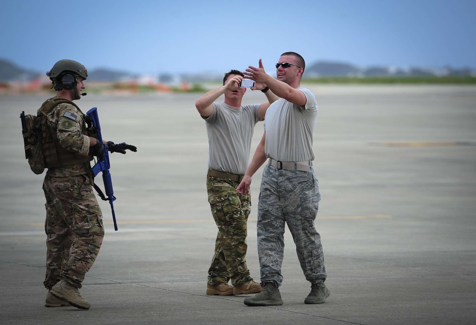 Senior Airman Daniel Willens, 1st Special Operations Security Forces Squadron deployed aircraft ground response element team member, controls opposition forces who are simulating an attempt to gain access to an aircraft on the flight line during a task force exercise at Hurlburt Field, Fla., July 24, 2015. Exercise scenarios included downed aircraft site security and armed escort. Through the scenarios, DAGRE was able to accomplish multiple training objectives including close quarters combat, small unit tactics, flight deck denial, fly away security, close air support, casual evacuation and more. (U.S. Air Force photo by Senior Airman Meagan Schutter)