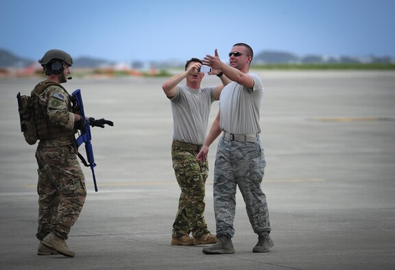Senior Airman Daniel Willens, 1st Special Operations Security Forces Squadron deployed aircraft ground response element team member, controls opposition forces who are simulating an attempt to gain access to an aircraft on the flight line during a task force exercise at Hurlburt Field, Fla., July 24, 2015. Exercise scenarios included downed aircraft site security and armed escort. Through the scenarios, DAGRE was able to accomplish multiple training objectives including close quarters combat, small unit tactics, flight deck denial, fly away security, close air support, casualty evacuation and more. (U.S. Air Force photo by Senior Airman Meagan Schutter)