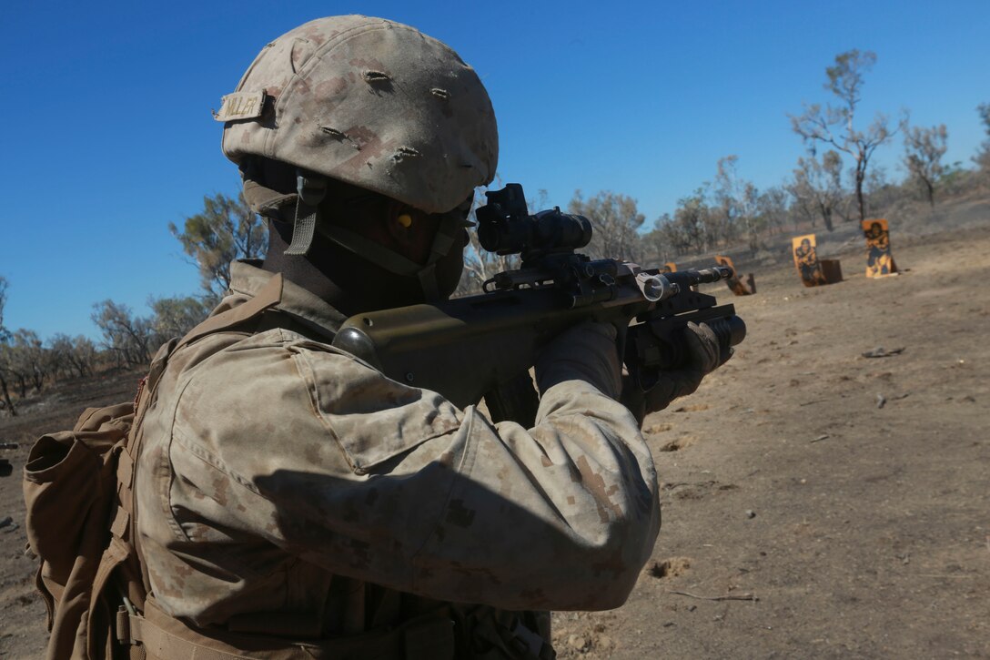 U.S. Marine Corps Lance Cpl. Douglas Miller shoots a F88 Austeyr assault rifle during a live-fire static range July 4 as part of Exercise Koolendong at Bradshaw Training Area, Northern Territory, Australia. Koolendong is a bilateral combined arms training exercise that combined light infantry, indirect fire weapons systems and air assets during training events. The rotational deployment of U.S. Marines in Darwin enables them to more effectively train, exercise, and operate with partners, enhances regional security and builds capacity to respond more rapidly to natural disasters and crises throughout that region. Miller is a rifleman with Company A, 1st Battalion, 4th Marine Regiment, Marine Rotational Force – Darwin.