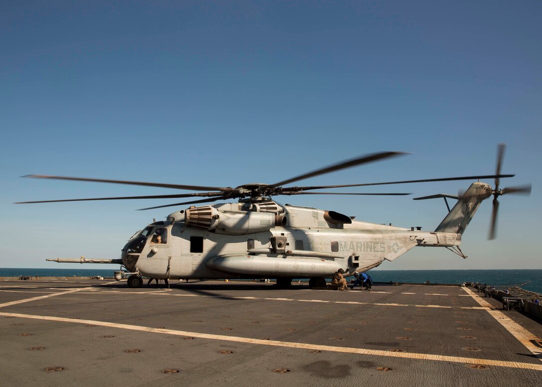 USNS Sacagawea (T-AKE-2) personnel and a U.S. Marine with Marine Heavy Helicopter Squadron 463, Marine Rotational Force – Darwin, tie down a CH-53E Super Stallion helicopter after transporting personnel July 5 from the Royal Australian Air force Base Darwin, Darwin, Northern Territory, Australia to the USNS Sacagawea. Two CH-53Es conducted the ship-landing operation, carrying approximately 20 personnel and practicing ship landing and take-off. The Marines are able to operate from the combat operations center aboard the USNS Sacagawea in support of Talisman Sabre 2015, which is a major Australian and U.S. military training exercise focused on mid-intensity “high end” war fighting. The MRF-D six-month deployment demonstrates how the Marine Air Ground Task Force is equipped and organized to carry out national objectives in cooperation with our national and international partners. 