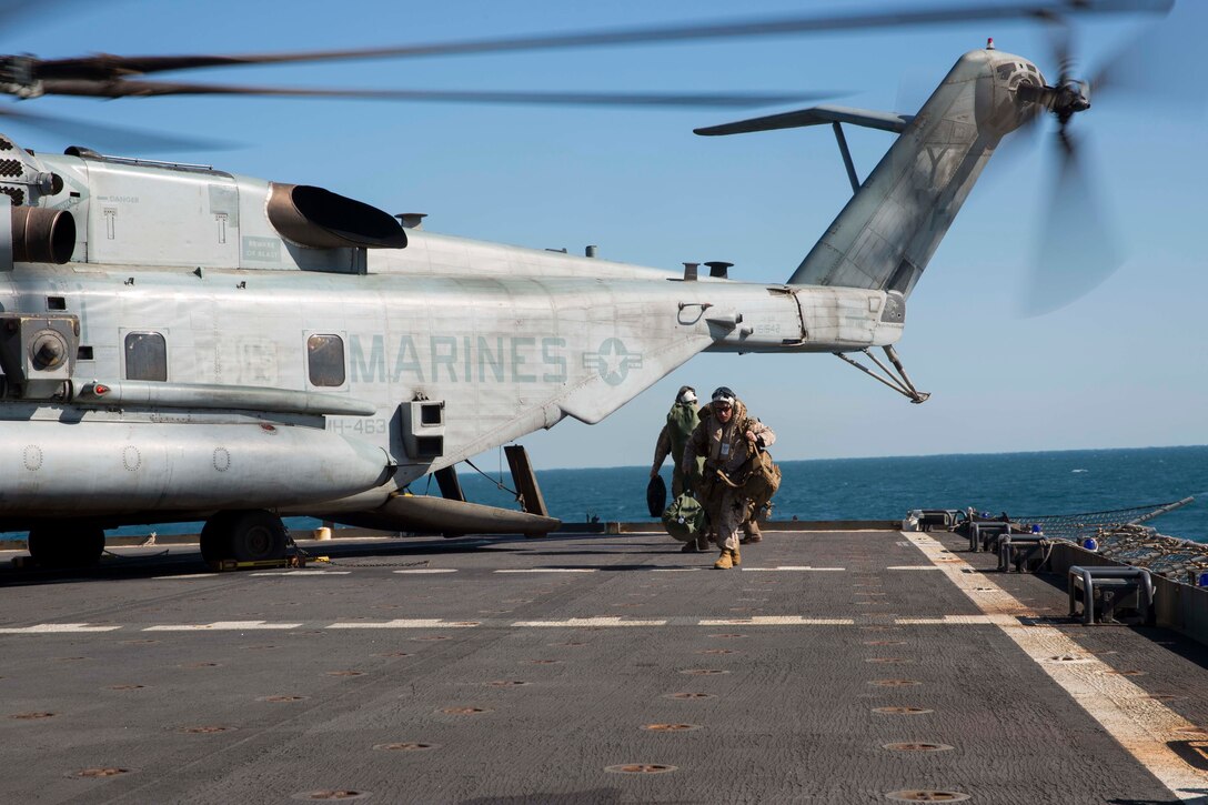 U.S. Marines exit a CH-53E Super Stallion helicopter from Marine Heavy Helicopter Squadron 463, Marine Rotational Force – Darwin, after being transported aboard ship July 5 from the Royal Australian Air force Base Darwin, Darwin, Northern Territory, Australia to the USNS Sacagawea (T-AKE-2). Two CH-53Es conducted the ship-landing operation, carrying approximately 20 personnel and practicing ship landing and take-off. The Marines are able to operate from the combat operations center aboard the USNS Sacagawea in support of Talisman Sabre 2015, which is a major Australian and U.S. military training exercise focused on mid-intensity “high end” war fighting. The MRF-D six-month deployment demonstrates how the Marine Air Ground Task Force is equipped and organized to carry out national objectives in cooperation with our national and international partners.