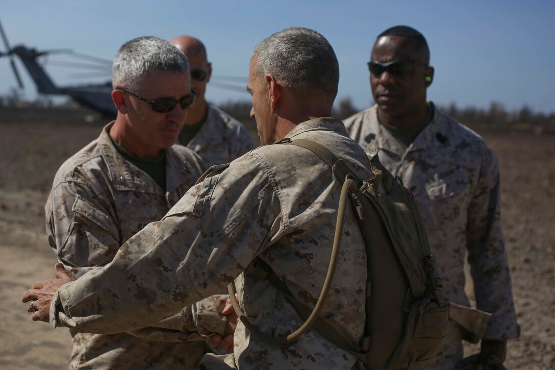 U.S. Marine Corps Brig. Gen. Paul J. Kennedy (left) is greeted by Col. David L. Odom (right) during Exercise Talisman Sabre 2015 at Bradshaw Field Training Area, Northern Territory, Australia, July 8. Exercises such as Talisman Sabre 2015 provide realistic, relevant training which is necessary to maintain regional security, peace, and stability. Talisman Sabre provides an invaluable opportunity to conduct operations in a combined, joint, and interagency environment that increases the U.S.-Australian alliance’s ability to plan and execute contingency responses, from combat missions to humanitarian assistance efforts. Kennedy is the commanding general of 3rd Marine Expeditionary Brigade, III Marine Expeditionary Force. Odom is the commanding officer of 4th Marine Regiment, 3rd Marine Division, III MEF.