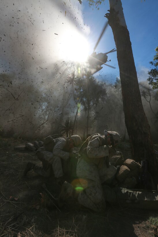 U.S. Marines with Company C, 1st Battalion, 4th Marine Regiment, Marine Rotational Force – Darwin, brace themselves as a CH-53E Super Stallion helicopter with Marine Heavy Helicopter Squadron 463 flies overhead July 15 during Exercise Talisman Sabre 2015 at Bradshaw Field Training Area, Northern Territory, Australia. The purpose of Talisman Sabre is to improve Australian-U.S. readiness for a wide variety of contingencies, strengthen interoperability, maximize combined training opportunities and conduct maritime prepositioning and logistics operations in maritime and littoral training areas of Australia. Talisman Sabre is a realistic and challenging exercise that improves both nations’ ability to work bilaterally, preparing U.S. and Australian service members to work together to provide security in the region and around the world.