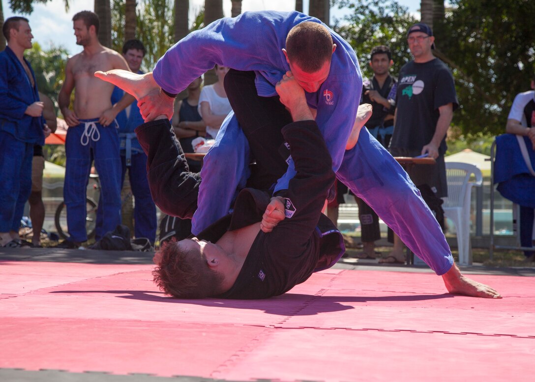 U.S. Marine Corps Capt. Dylan Grayston, a Seattle, Washington native, attempts to maintain control of his opponent Marc Gayson, a native of New Castle, Australia, July 26 during the Australia Federation of Brasilian Jiu Jitsu 2015 Northern Territory State Titles at the Darwin Waterfront, Darwin, Northern Territory, Australia. Marine community engagements in the Northern Territory are intended to add depth to our relationship with Australia. Beyond purely military training, we greatly appreciate Australia’s hospitality and believe we have much to learn, and much to share, with our gracious hosts. Grayston is a CH-53E Super Stallion helicopter pilot with Marine Heavy Helicopter Squadron 463, Marine Rotational Force – Darwin.