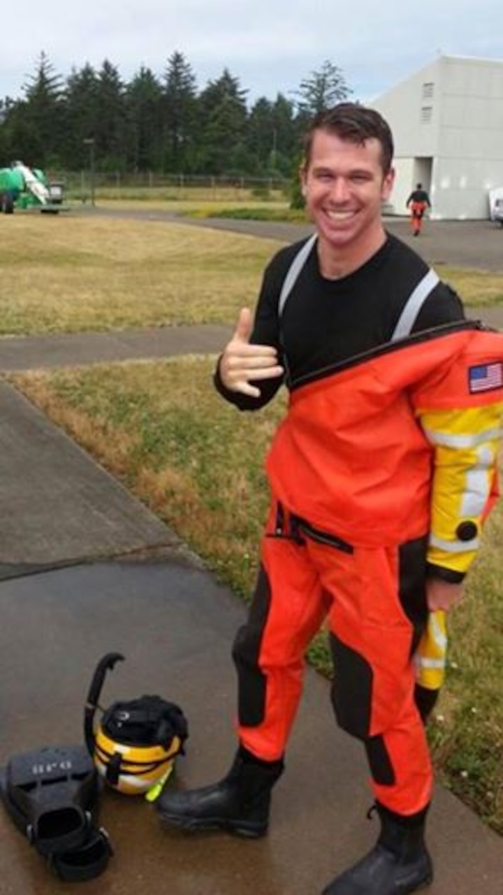 Coast Guard Petty Officer 2nd Class Darren Harrity, an aviation survival technician assigned to Coast Guard Air Station North Bend, rescued four people from a fishing vessel that ran aground in the early morning hours of July 21, 2015. U.S. Coast Guard photo