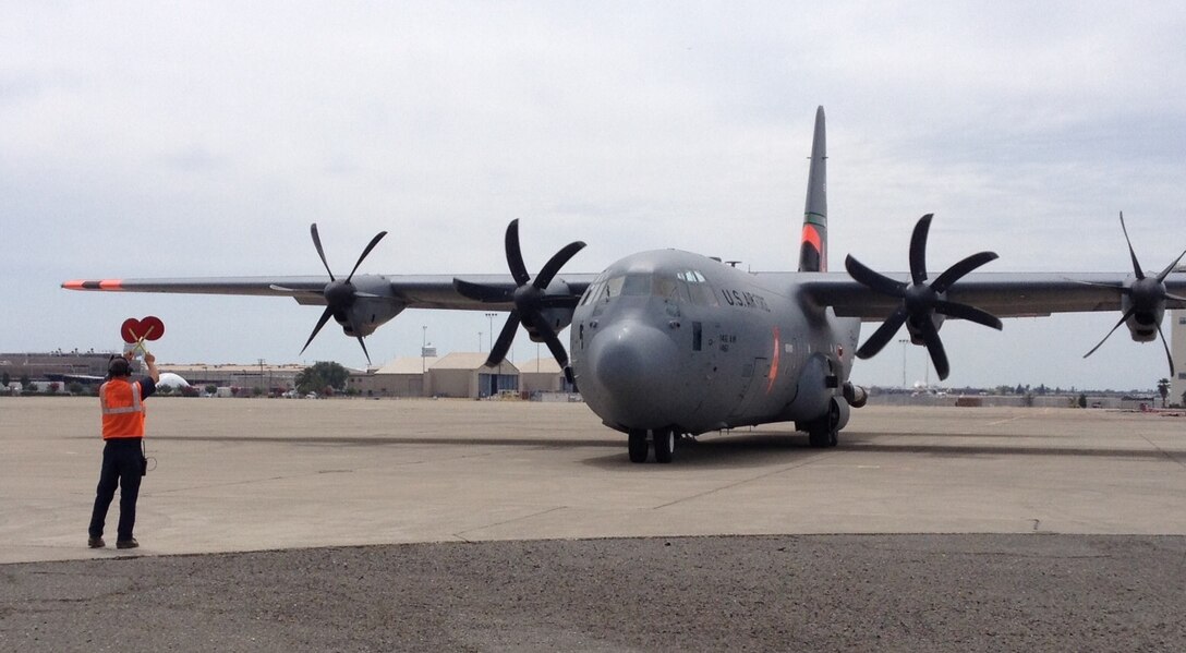 A C-130J Super Hercules, assigned to the California Air National Guard's 146th Airlift Wing, taxis to a reload "pit" to take on nearly 3,000 gallons of fire retardant at McClellan Air Tanker Base in Sacramento, California, Aug. 4, 2015. The aircrew received a tasking to provide support to the growing Rocky Fire north of San Francisco, which had consumed approximately 65,000 acres as of Aug. 4. The crew was joined three other C-130s from both the 146th AW and the Air Force Reserve's 302nd Airlift Wing to combat the Rocky Fire. The aircraft contain the Modular Airborne Fire Fighting System which allows them to support wildfire containment in conjunction with fire crews on the ground. The 146th AW is based in Channel Islands, while the 302nd AW is stationed at Peterson Air Force Base, Colorado. (U.S. Air Force photo/2nd Lt. Stephen J. Collier)