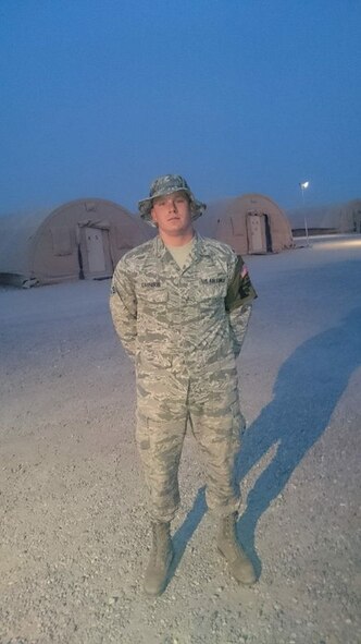 Senior Airman Joshua Calhoun, 62nd Maintenance Squadron precision measurement equipment laboratory journeyman, stands outside the barracks at an undisclosed location, Southwest Asia, Aug. 3, 2015. Calhoun will be recognized as a hero by the American Red Cross Northwest Chapter in a ceremony Oct. 13, 2015, in Tacoma, Wash. (Courtesy photo)