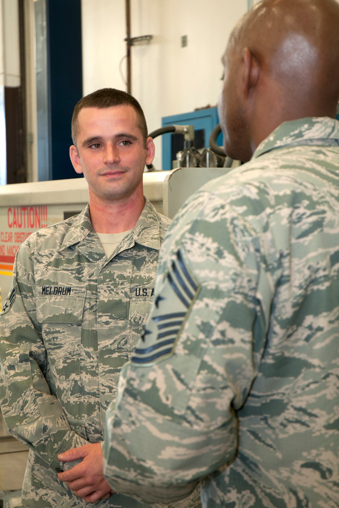 Senior Airman James Meldrum, an aircraft structural maintenance technician
with the 446th Maintenance Squadron, discusses the biggest challenges facing
the Air Force Reserve Command with Chief Master Sgt. Cameron Kirksey at
Joint Base Lewis-McChord, Wash., Aug. 1, 2015. Kirksey, the AFRC command
chief, visited with members of the 446th Airlift Wing Aug. 1-2 to gain a
better perspective on their mission of strategic airlift and airdrop as well
as any issues the Air Force Reservists face. Meldrum said the chief seemed
impressed with the work of the fabrifcation flight. "He was also interested
in our careers and what we thought of the direction of the Air Force,"
Meldrum said. (U.S. Air Force photo/2nd Lt. Stephen J. Collier)
