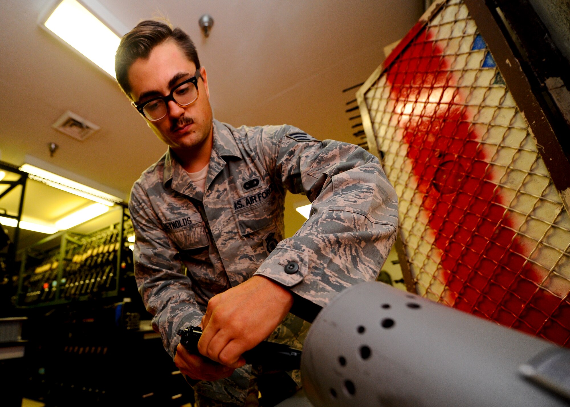 Senior Airman Cody Reynolds, 22nd Security Forces Squadron on-duty armorer, clears an M9 pistol, Aug. 4, 2015, at McConnell Air Force Base, Kan. Defenders constantly utilize proper weapon handling procedures to prevent any unnecessary risk to themselves and the Airmen around them. (U.S. Air Force photo by Senior Airman Victor J. Caputo)