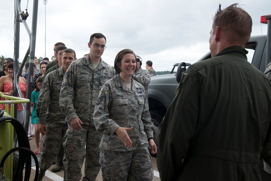Airmen from the 23d Fighter Group congratulate U.S. Air Force Col. Derek Oaks, 23d FG commander, after his final flight Aug. 3, 2015, at Moody Air Force Base, Ga. Oaks directed the largest A-10C Thunderbolt II operational fighter group consisting of the 74th and 75th Fighter Squadrons and the 23d Operations Support Squadron for two years. (U.S. Air Force photo by Airman 1st Class Kathleen D. Bryant/Released)

