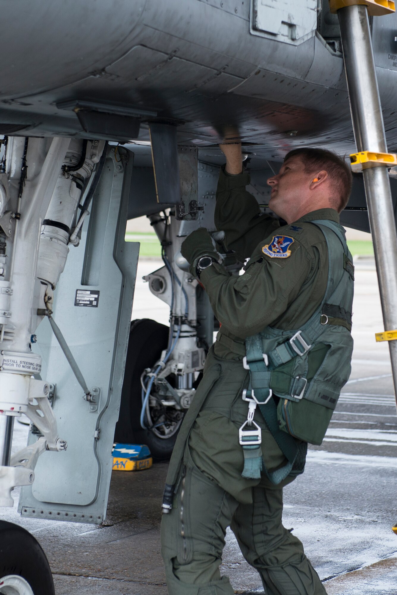U.S. Air Force Col. Derek Oaks, 23d Fighter Group commander, performs a pre-flight inspection on an A-10C Thunderbolt II Aug. 3, 2015, at Moody Air Force Base, Ga. Oaks conducted his final flight in the A-10 before his retirement from the Air Force. (U.S. Air Force photo by Airman 1st Class Kathleen D. Bryant/Released)
