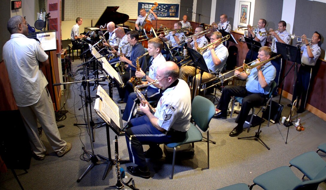 The Falconaires (plus a few retirees) are pictured performing live on the air with Rodney Franks (left) who hosts "Into the Evening" on KUVO Denver.  The performance was played over the radio as well as streamed over the Internet.