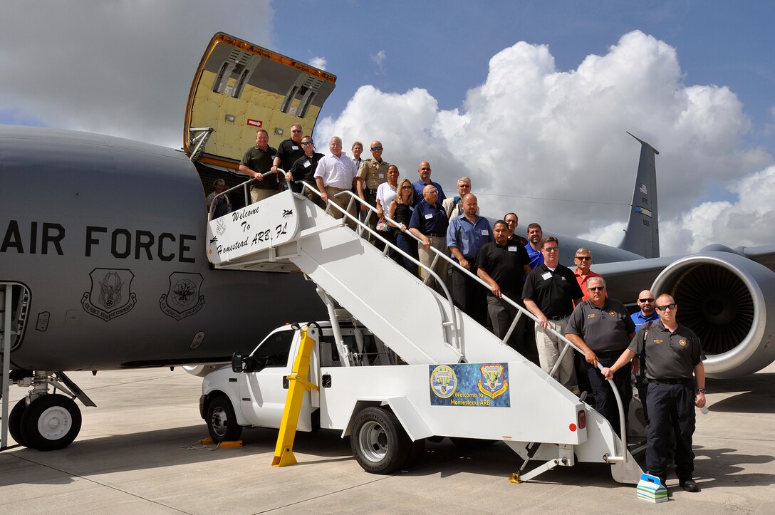 Employers from the South Florida community disembark a KC-135 Stratotanker assigned to the 507th Air Refueling Wing from Tinker Air Force Base, Okla., after refueling F-16’s assigned to the 93rd Fighter Squadron, Homestead Air Reserve Base, Fla., as part of an Employer Support of the Guard and Reserve ‘Bosslift’ in July. (U.S. Air Force photo/Maj. Eugenia Ramirez-Griffin).