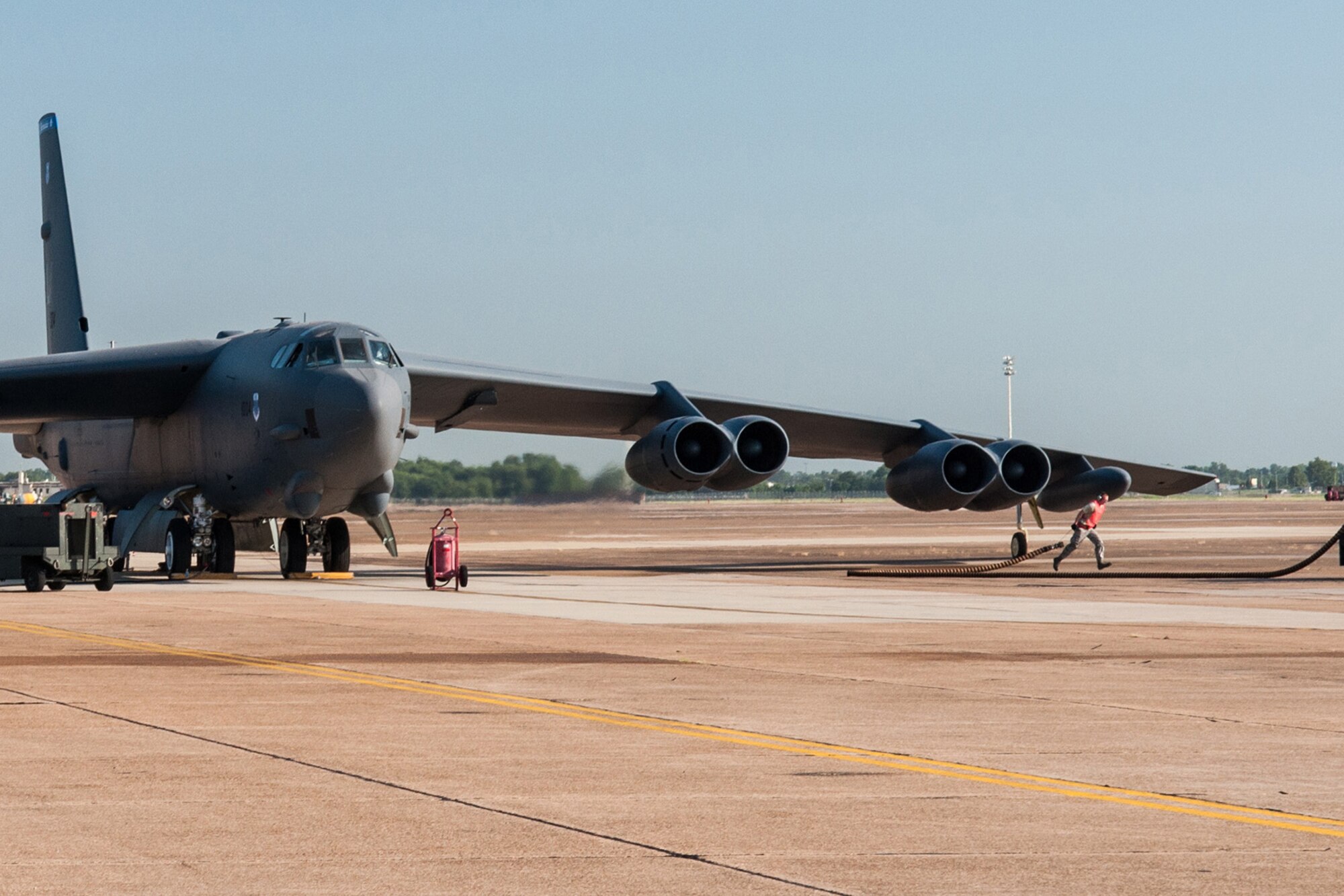 U.S. Air Force Airman First Class William Luster, a crewchief assigned to the 2nd Aircraft Maintenance Squadron, prepares a B-52H Stratofortress for take-off on Jul. 28, 2015 on Barksdale Air Force Base, La. The aircrew manning the bomber is on their way to be the first all Reserve aircrew to be certified in the combat network communications technology (CONECT) modification that upgrades and enhances the bomber’s technology to include real-time communications uplinks, computer network servers, and color digital display screens. (U.S. Air Force photo by Master Sgt. Dachelle Melville/Released)