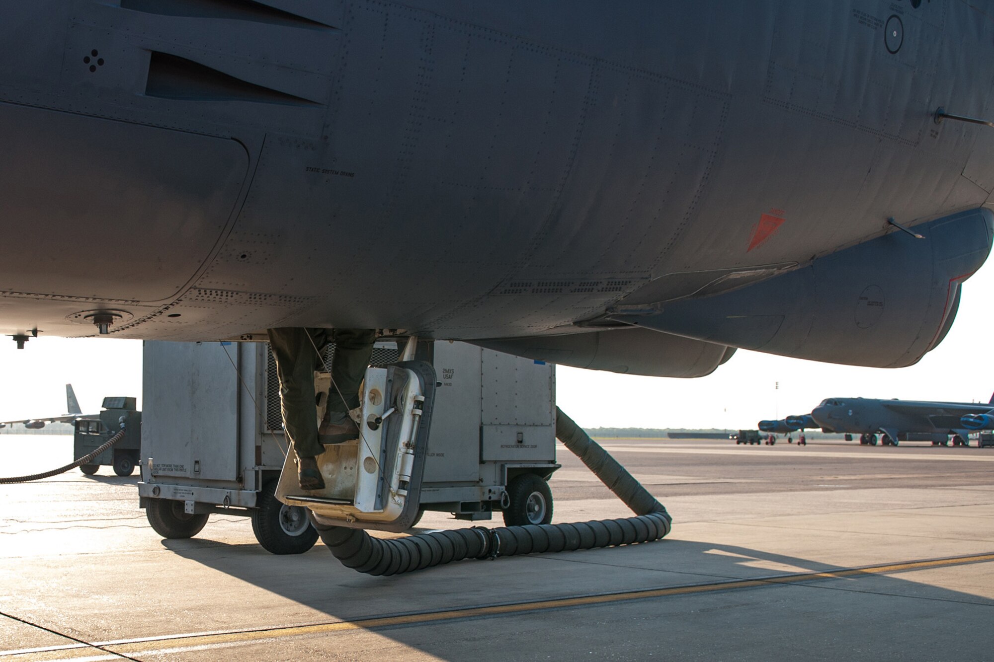 The last crewmember of the U.S. Air Force Reserve aircrew assigned to the 343rd Bomb Squadron, call sign “Chaos 43,” enters a B-52H Stratofortress on Jul. 28, 2015 on Barksdale Air Force Base, La. The aircrew is preparing to take off on a mission to become certified on the new combat network communications technology (CONECT) modification that upgrades and enhances the bomber’s technology to include real-time communications uplinks, computer network servers, and color digital display screens. (U.S. Air Force photo by Master Sgt. Dachelle Melville/Released)
