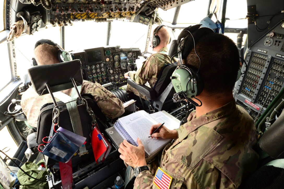 U.S. California Air National Guardsman Capt. Kenley Lok, Combat Systems operator with the 130th Rescue Squadron, Moffett Federal Airfield, Calif., determines the location of the MC-130P Combat Shadow aircraft during Angel Thunder 2015 exercises, Davis-Monthan AFB, Ariz., June 5, 2015. Determining correct location coordinates is vital during search and rescue operations.  (U.S. Air National Guard photo by Senior Airman Rachael Kane/Released)