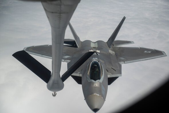 An F-22A Raptor from the 95th Fighter Squadron stationed with the 325th Fighter Wing, Tyndall Air Force Base, Florida, prepares to refuel from a KC-135 Stratotanker from the 93rd Air Refueling Squadron, Fairchild AFB, Washington, over the Nevada Test and Training Range during Red Flag 15-3 at Nellis AFB, Nevada, July 31, 2015. Red Flag gives Airmen an opportunity to experience realistic, stressful combat situations in a controlled environment to increase their ability to complete missions and safely return home. (U.S. Air Force photo by Senior Airman Brittany A. Chase)