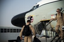 Members from the 763rd Expeditionary Reconnaissance Squadron exit an RC-135V/W Rivet Joint aircraft July 24, 2015, at Al Udeid Air Base, Qatar. The Rivet Joint aircraft hit 25 straight years of continuous deployment to U.S. Central Command’s area of responsibility on Aug. 9. (U.S. Air Force photo by Tech. Sgt. Rasheen Douglas)
