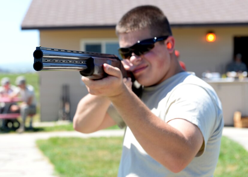 Airman 1st Class Cole Barnhart, 28th Operations Support Squadron aircrew flight equipment technician, participates in a round of trap and skeet shooting during an event hosted by Chief Master Sgt. Kevin Peterson, 28th Bomb Wing command chief, at Ellsworth Air Force Base, S.D., July 23, 2015. Participants had a chance to try something new while meeting other Airmen during their lunch hour. (U.S. Air Force photo by Senior Airman Rebecca Imwalle/Released)