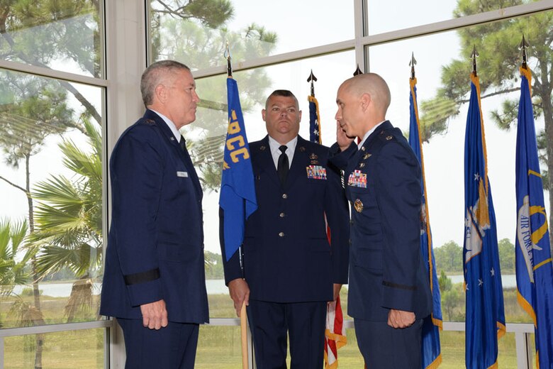 After accepting command during an Air Force Rescue Coordination Center change of command ceremony July 29, incoming commander, Lt. Col. James Woosley,  salutes Lt. Gen. William Etter, Commander, Continental U.S. Aerospace Defense Command Region – 1st Air Force (Air Forces Northern). (U.S. Air Force photo released/Capt. Jared Scott)