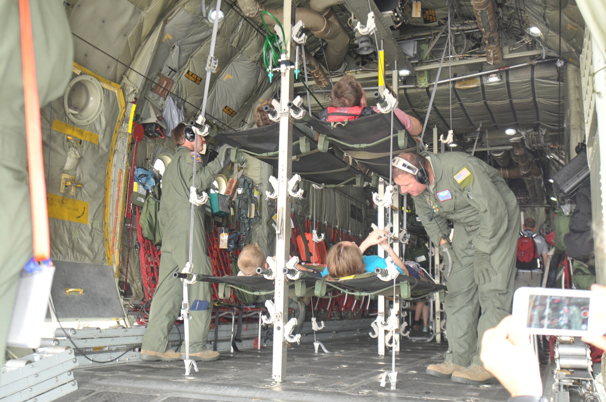 Members of the New York Air National Guard's 139th Aeromedical Evacuation Squadron, the Tennessee Air National Guard's 118th Medical Group, and the Albany Stratton Veterans Affairs Medical Center carry "patients", made up from the New York Civil Air Patrol, from the staging area tent to an LC-130 Hercules aircraft during an exercise at Stratton Air National Guard Base, Scotia, New York. The National Disaster Medical System Exercise, held July 27, 2015 through Aug. 2, 2015, demonstrated interagency partnership among the Department of Health and Human Services, the Department of Homeland Security, the Department of Defense, and the Department of Veterans Affairs and the instrumental role of aeromedical evacuation in the national emergency response and national defense frameworks. (U.S. Air National Guard photo by Master Sgt. William Gizara/Released)