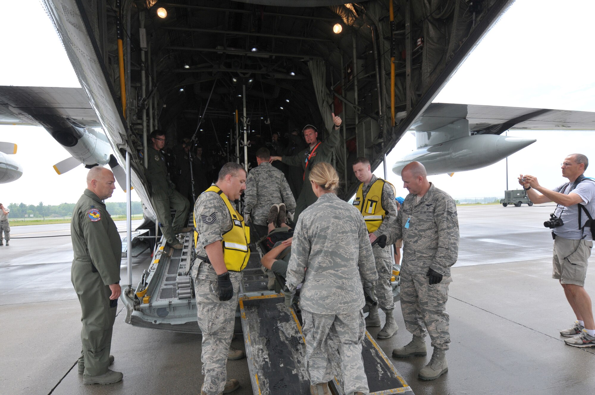 Members of the New York Air National Guard's 139th Aeromedical Evacuation Squadron, the Tennessee Air National Guard's 118th Medical Group, and the Albany Stratton Veterans Affairs Medical Center carry "patients", made up from the New York Civil Air Patrol, from the staging area tent to an LC-130 Hercules aircraft during an exercise at Stratton Air National Guard Base, Scotia, New York. The National Disaster Medical System Exercise, held July 27, 2015 through Aug. 2, 2015, demonstrated interagency partnership among the Department of Health and Human Services, the Department of Homeland Security, the Department of Defense, and the Department of Veterans Affairs and the instrumental role of aeromedical evacuation in the national emergency response and national defense frameworks. (U.S. Air National Guard photo by Master Sgt. William Gizara/Released)