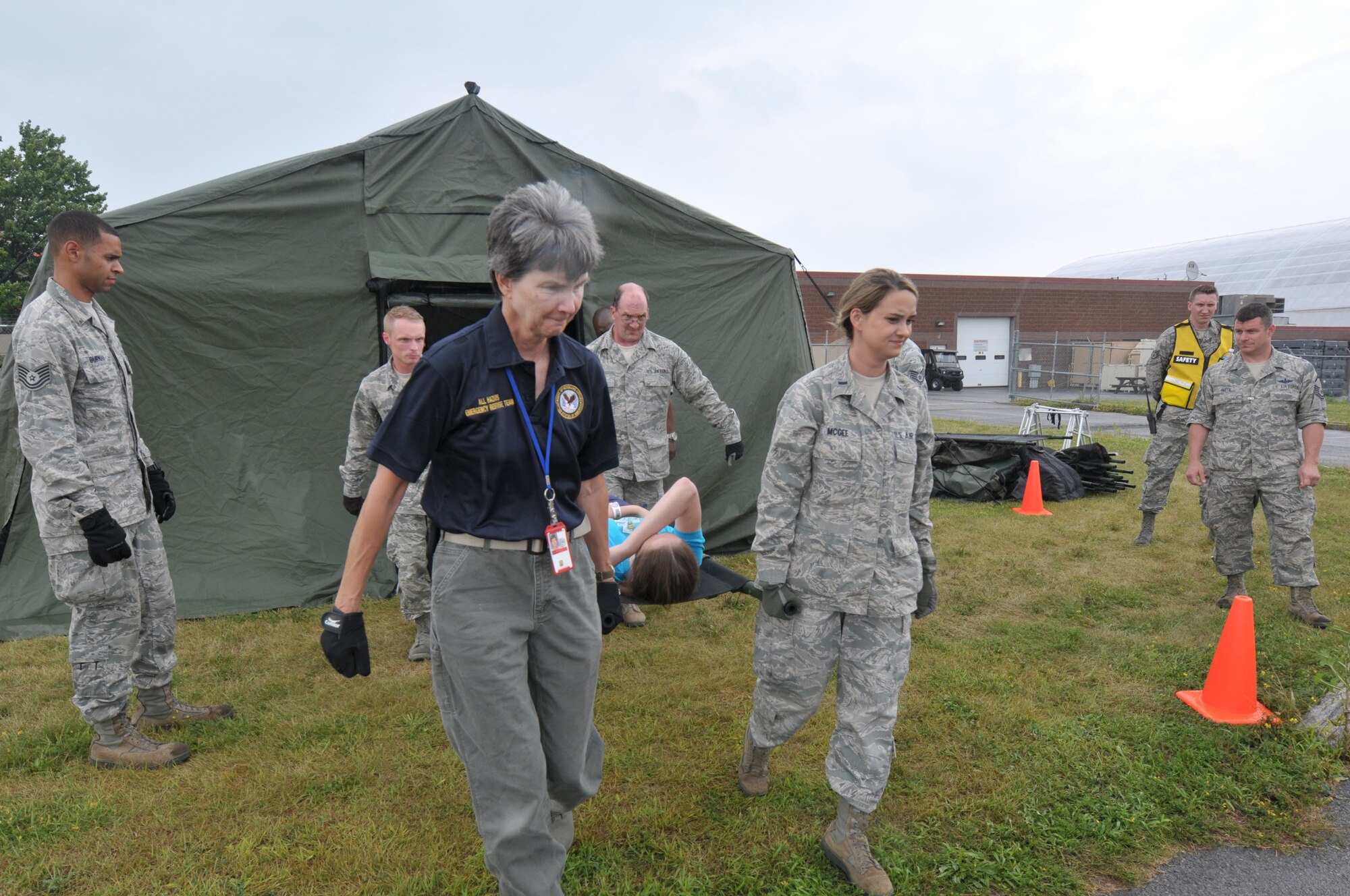 Members of the New York Air National Guard's 139th Aeromedical Evacuation Squadron, the Tennessee Air National Guard's 118th Medical Group, and the Albany Stratton Veterans Affairs Medical Center carry "patients", made up from the New York Civil Air Patrol, from the staging area tent to an LC-130 Hercules aircraft during an exercise at Stratton Air National Guard Base, Scotia, New York. The National Disaster Medical System Exercise, held July 27, 2015 through Aug. 2, 2015, demonstrated interagency partnership among the Department of Health and Human Services, the Department of Homeland Security, the Department of Defense, and the Department of Veterans Affairs and the instrumental role of aeromedical evacuation in the national emergency response and national defense frameworks. (U.S. Air National Guard photo by Master Sgt. William Gizara/Released)