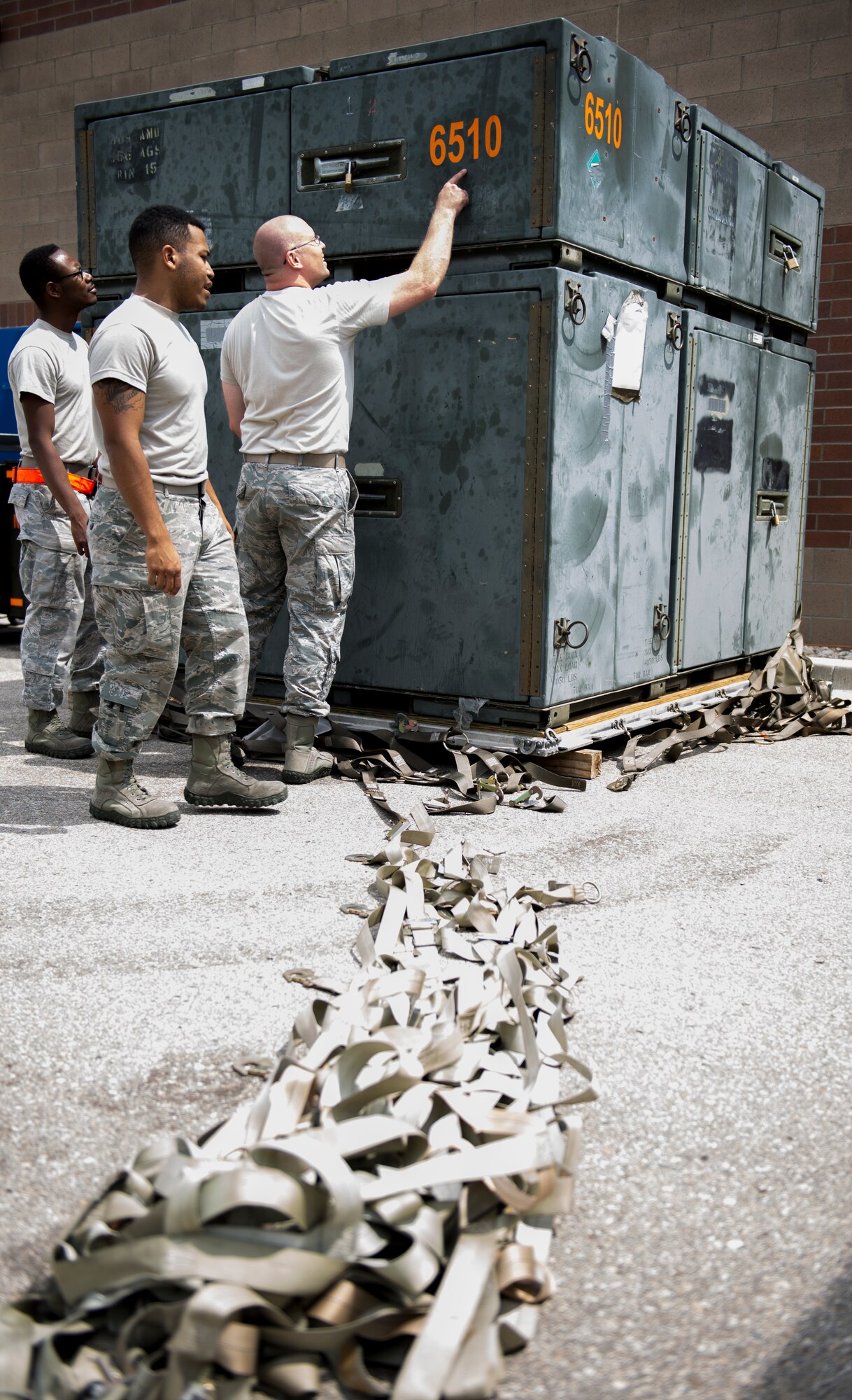 Airmen from Mountain Home Air Force Base unload cargo at Gowen Field Air National Guard base in Boise, Idaho, Aug 3, 2015. The installation deployment officer and Logistics Plans help coordinate supplies needed, cargo and transportation for deployments and exercises. (U.S. Air Force photo by Airman 1st Class Jessica H. Evans/RELEASED)