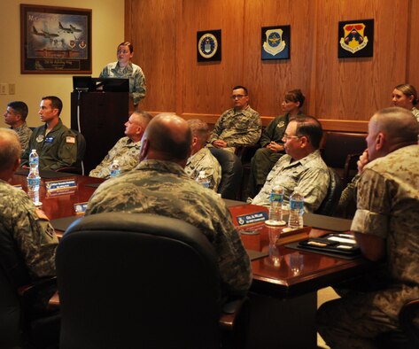 Tech. Sgt. Anne Phillips, 931 MXS jet engine mechanic, briefs U.S. Marine Corps Sgt. Maj. Bryan Battaglia, senior enlisted advisor to the chairman of the joint chiefs of staff, and McConnell Leaders on the base's total force mission, July 30, 2015.  Battaglia toured various units around base and he visited Airmen performing their job to learn about the mission. (U.S. Air Force photo by Tech. Sgt. Abigail Klein)