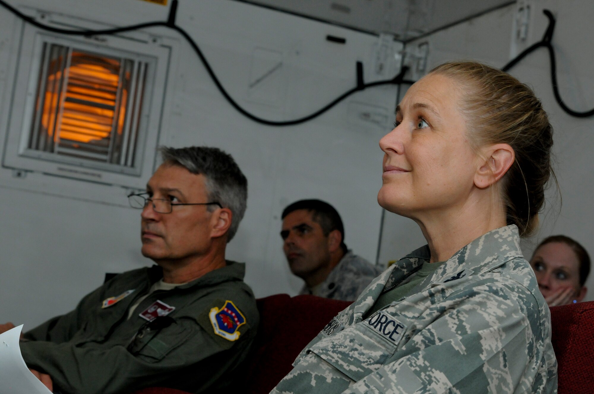 Tech. Sgt. Robert Ellis, Detachment 1 Joint Terminal Attack Controller liaison and evaluator, briefs Brig. Gen. Kurt Vogel, commander of the Arkansas Air National Guard, and Col. Bobbi Doorenbos, commander of the 188th Wing, on the outlined training scenario they will witness at Razorback Range Aug. 1, 2015. Razorback Range is a key asset that provides unique, quality training opportunities for all branches of the military, special operations forces and aviation units on close air support, combat search and rescue and also provides specialized training for units. (U.S. Air National Guard photo by Capt. Holli Nelson/Released)