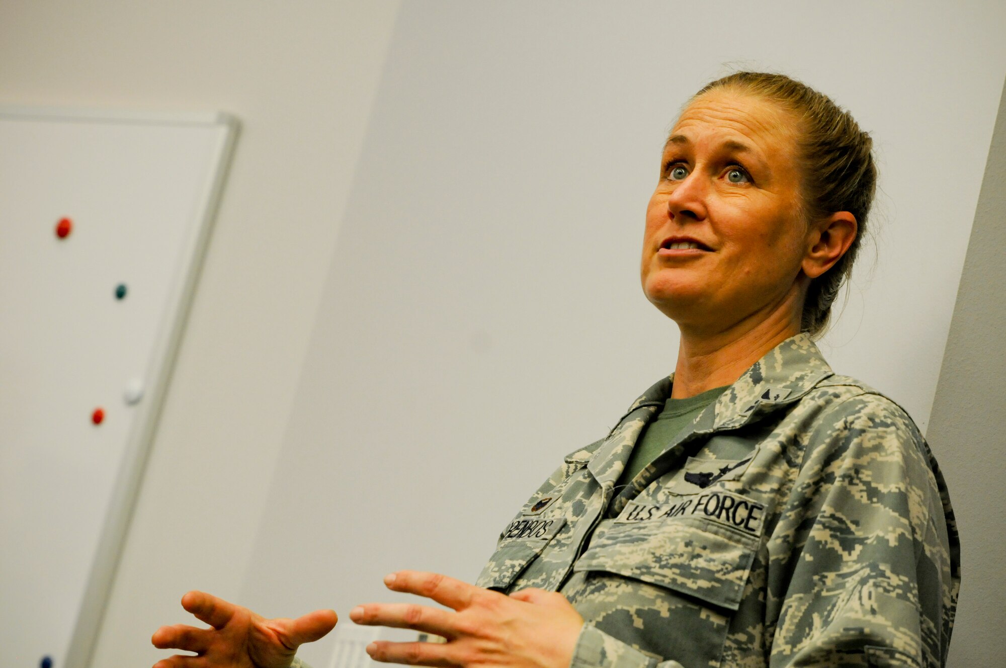 Col. Bobbi Doorenbos, commander of the 188th Wing, speaks to Airmen during a newcomers orientation class held Aug. 1, 2015 at Ebbing Air National Guard Base, Ark. Doorenbos showed Brig. Gen Kurt Vogel, commander of the Arkansas Air National Guard, the unique capabilities of the 188th Wing during a two-day tour. (U.S. Air National Guard photo by Capt. Holli Nelson/Released)
