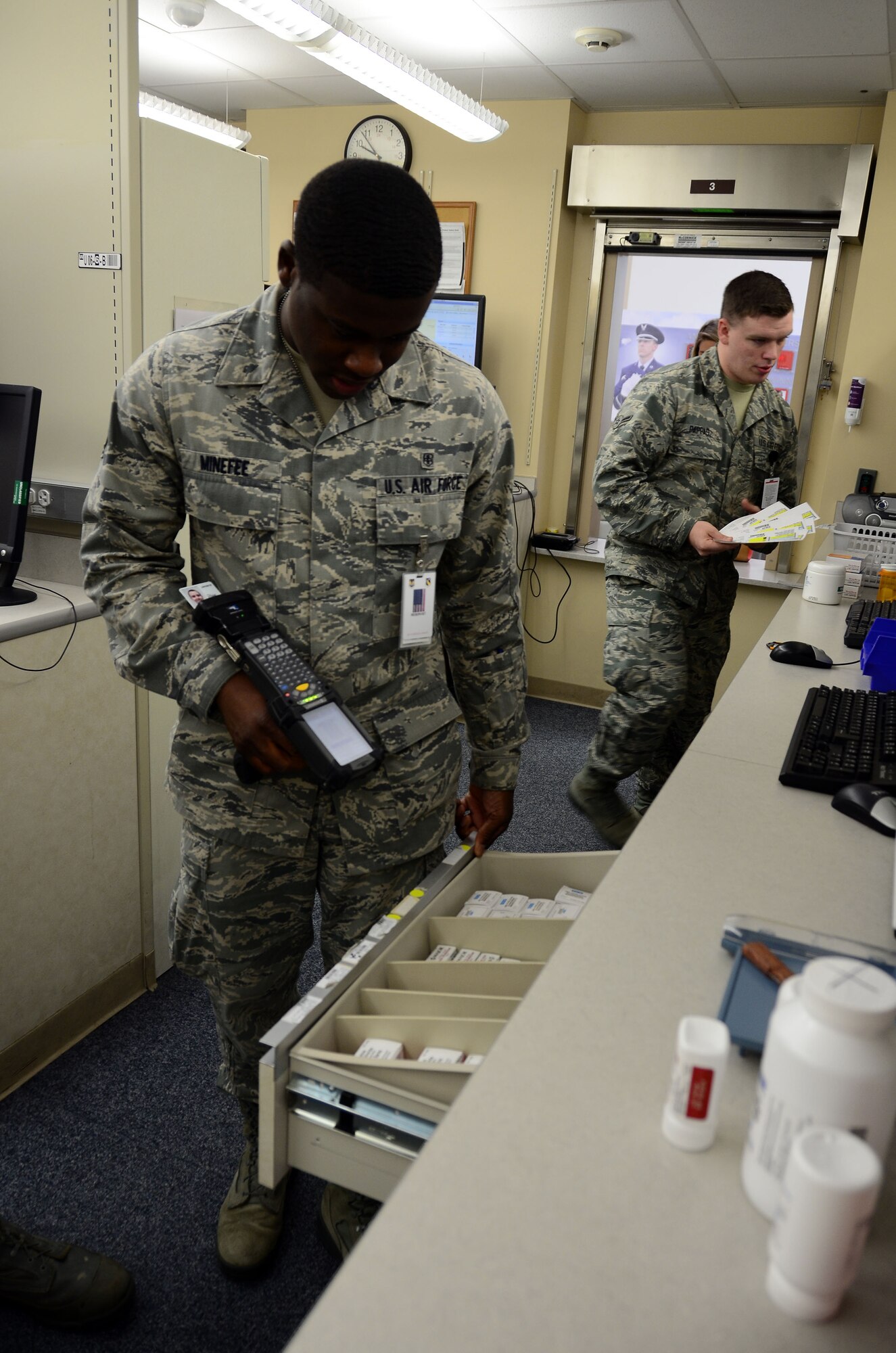WRIGHT-PATTERSON AIR FORCE BASE, Ohio – Staff Sgt. Joshua Minefee, medical materiel journeyman, and Airman John Pappas III, pharmacy journeyman, inventory and prepare prescriptions during their two-week annual tour at the Wright Patterson AFB Medical Center July 16th, 2015. The 445th Aeromedical Staging Squadron Airmen were training alongside the 88th Medical Group active duty personnel to fulfill their training requirements at the base hospital July 11-25. (U.S. Air Force photo/Senior Airman Joel McCullough)