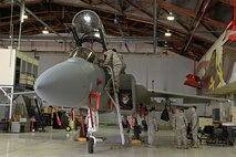 Members from the 9th Civil Engineer Squadron Explosive Ordinance Disposal Flight, train with the 173rd Fighter Wing, to learn egress protocol on an F-15 Eagle at Kingsley Field Air National Guard Base, Oregon, July 30, 2015. The EOD technicians received hands on training and provided safety support for Sentry Eagle 15 July 30 to Aug. 2, 2015. (U.S. Air Force photo by Airman 1st Class Ramon A. Adelan)