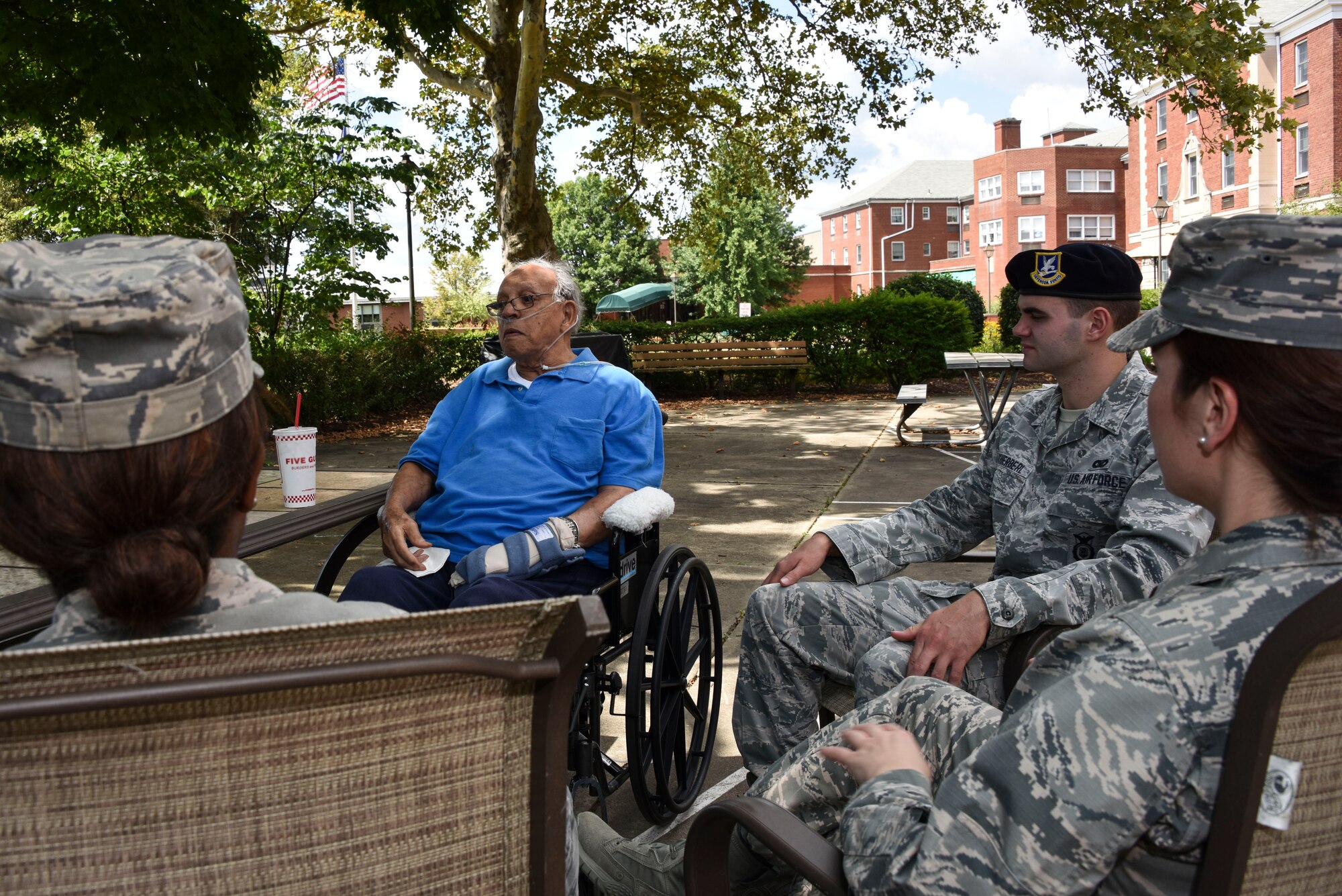 Kingsley Carey, a former Tuskegee Airman, speaks with members of the 911th Airlift Wing outside of a nursing home in Pittsburgh, Pa., Aug. 1, 2015. Carey, who is now 98 years-old, shared both good and bad memories so that the current generation of Airmen could benefit from his experience. (U.S. Air Force photo by Staff Sgt. Joshua J. Seybert)