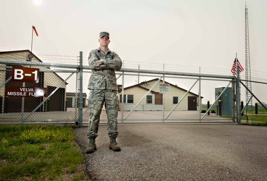 Master Sgt. Sean Walko, 740th Missile Squadron superintendent and facility manager, poses in front of a missile alert facility in North Dakota, July 2, 2015. Facility managers are trained in routine procedures such as the daily upkeep of essential equipment and emergency actions for contingency and combat scenarios. Their job directly supports security forces, maintenance and missile combat crew teams that utilize the facilities. (U.S. Air Force photo/Airman 1st Class Sahara L. Fales)