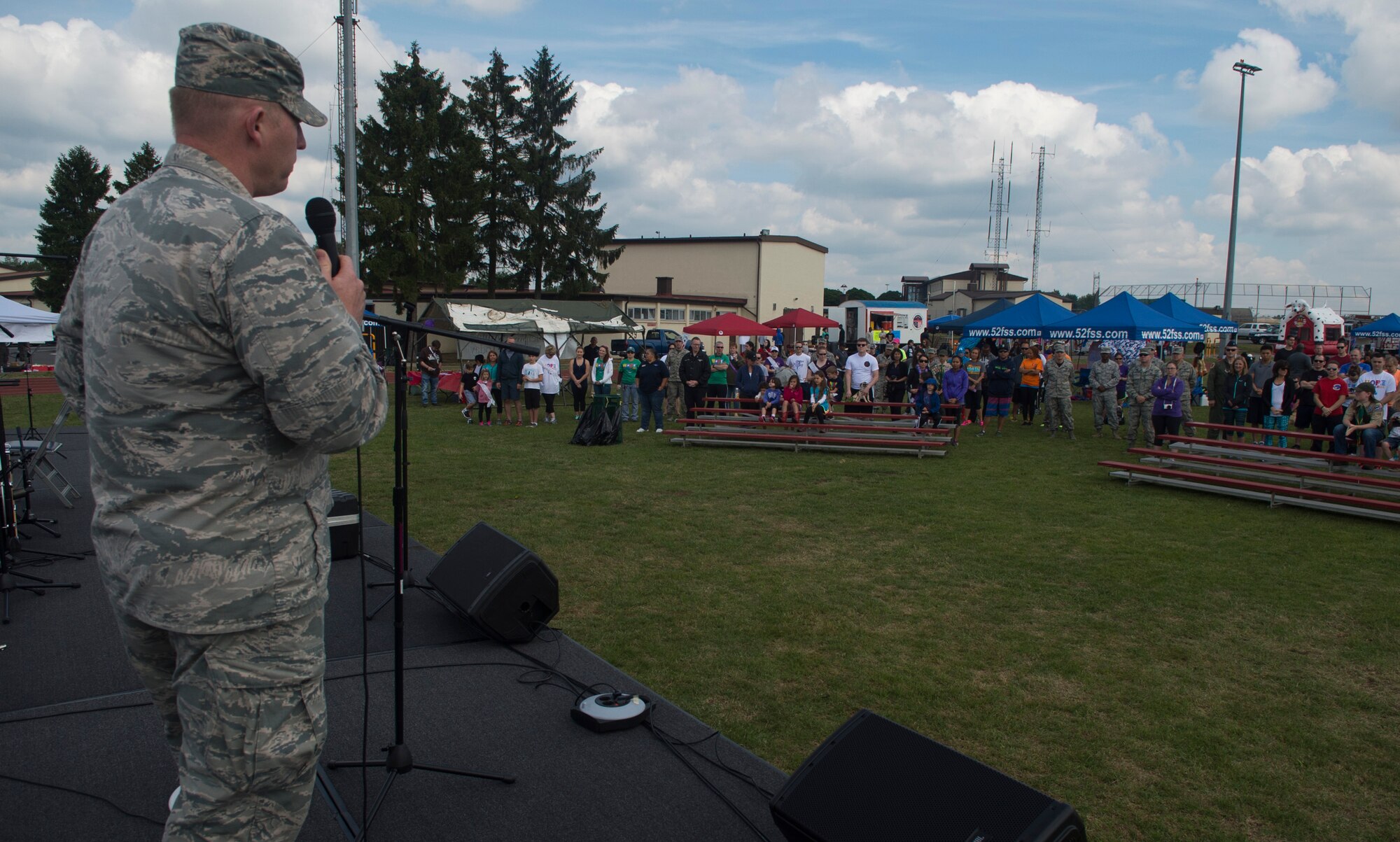 U.S. Air Force Col. Joe McFall, 52nd Fighter Wing commander, gives an opening speech before the start of the Relay for Life event at the outdoor track on Spangdahlem Air Base, Germany, July 31, 2015. More than 200 people participated in the 12-hour event which consisted of different themed music and costumes each hour. (U.S. Air Force photo by Airman 1st Class Luke Kitterman/Released) 