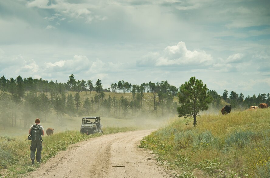 A 919th Special Operations Security Forces Squadron Airman walks back to his vehicle after an exercise scenario during the squadron’s annual training at Camp Guernsey, Wyo., Aug. 3.  More than 20 Airmen went out West to help train two other Reserve security forces squadrons in ground combat and field training.  The 919th SOSFS Airmen lived in the makeshift camps and acted as opposing forces and local villagers interacting with the occupying security teams. (U.S. Air Force photo/Tech. Sgt. Sam King)