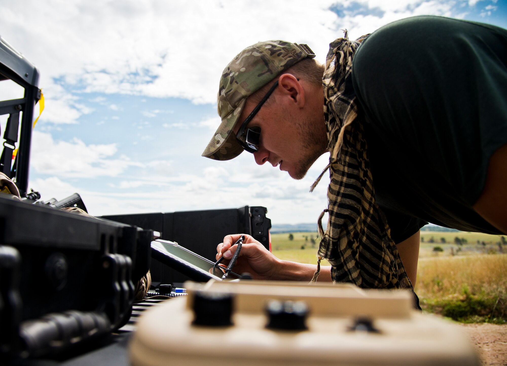Staff Sgt. Leland Hastings, 919th Special Operations Security Forces Squadron, monitors the Raven-B, a four-by-four foot unmanned aerial system, through a laptop computer at Camp Guernsey, Wyo., Aug. 4.  The 919th SOSFS brought the UAS to demonstrate its capabilities to other security forces units involved in a large field training exercise at the camp. The Raven-B has the ability to take photos, video in day or night, and even designate locations via an IR laser.  It also provides coordinates, magnetic azimuths, and linear distances creating a birds-eye view to topographical map. (U.S. Air Force photo/Tech. Sgt. Sam King)