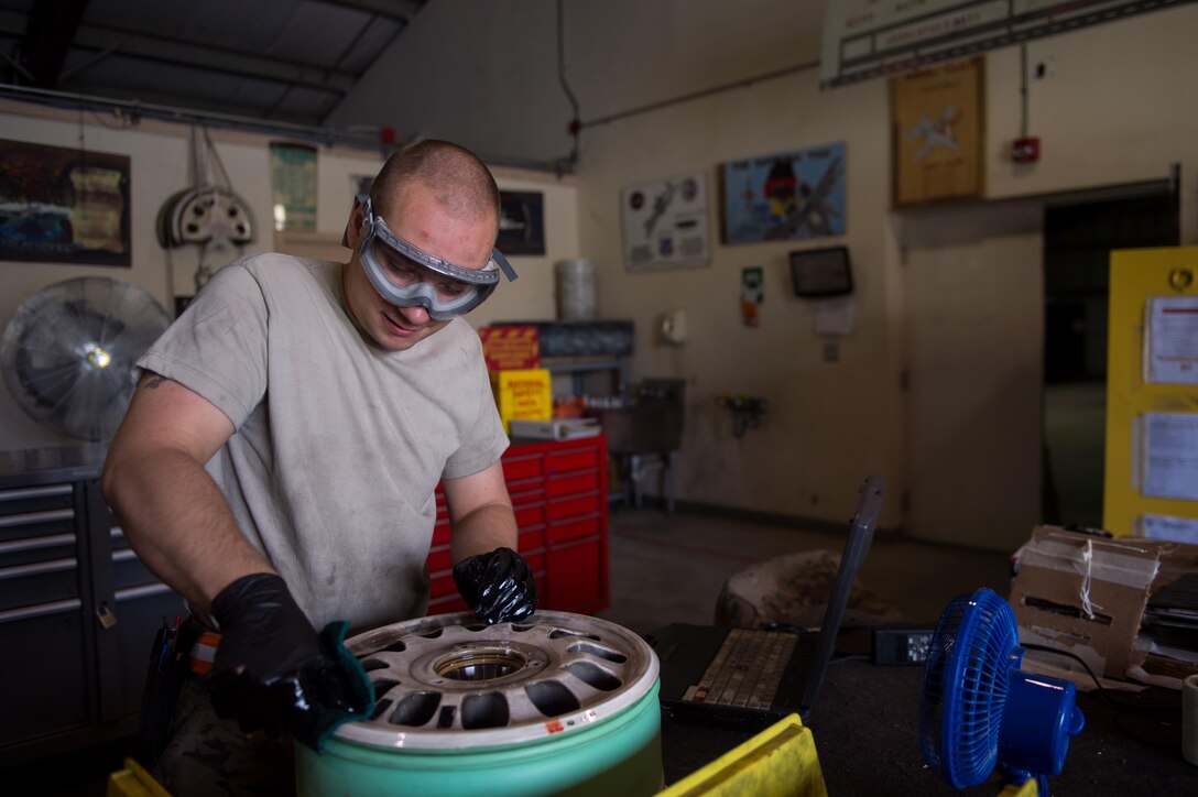 U.S. Air Force Staff Sgt. William “Willy” Reibsome III, 455th Expeditionary Maintenance Squadron wheel and tire noncommissioned officer in charge, cleans and inspects an F-16 Fighting Falcon aircraft wheel at Bagram Airfield, Afghanistan, Aug. 2, 2015. Reibsome ensures that F-16s at BAF have serviceable tires to complete the combat airpower mission; on average he works 70 wheels per month. (U.S. Air Force photo by Tech. Sgt. Joseph Swafford/Released)