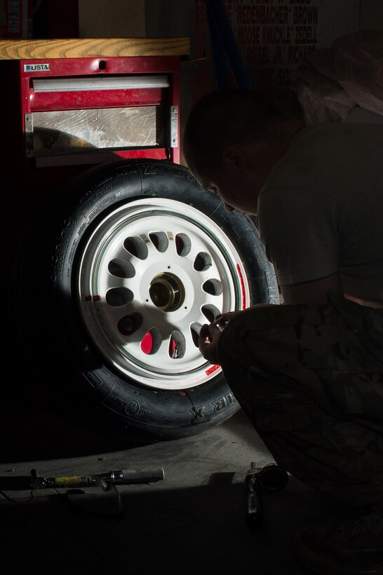 U.S. Air Force Staff Sgt. William “Willy” Reibsome III, 455th Expeditionary Maintenance Squadron wheel and tire noncommissioned officer in charge, cleans and inspects an F-16 Fighting Falcon aircraft tire at Bagram Airfield, Afghanistan, Aug. 2, 2015. Reibsome ensures that F-16s at BAF have serviceable tires to complete the combat airpower mission; on average he works 70 wheels per month. (U.S. Air Force photo by Tech. Sgt. Joseph Swafford/Released)