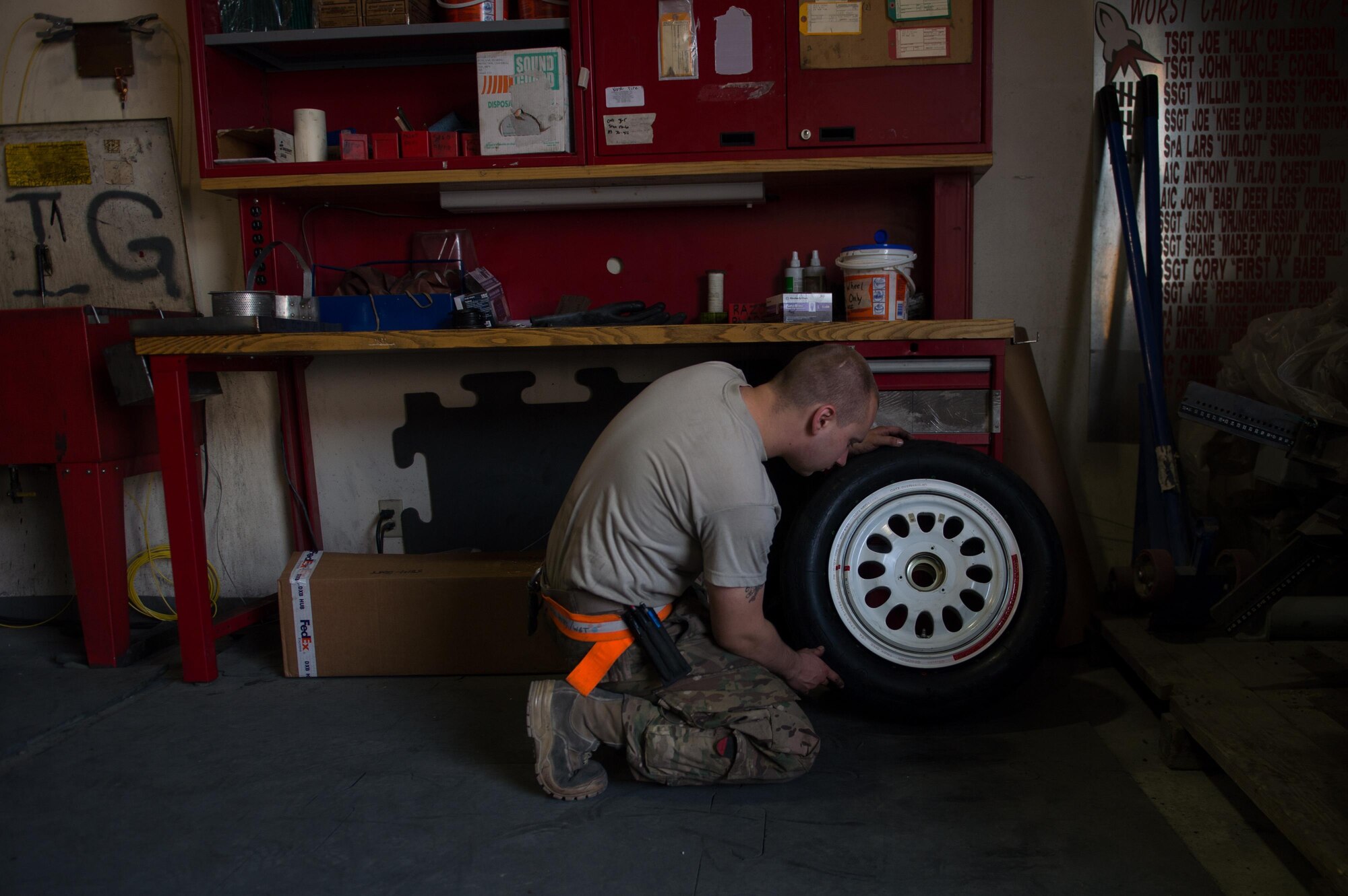 U.S. Air Force Staff Sgt. William “Willy” Reibsome, 455th Expeditionary Maintenance Squadron wheel and tire noncommissioned officer in charge, cleans and inspects an F-16 Fighting Falcon aircraft tire at Bagram Airfield, Afghanistan, Aug. 2, 2015. Reibsome ensures that F-16s at BAF have serviceable tires to complete the combat airpower mission; on average he works 70 wheels per month. (U.S. Air Force photo by Tech. Sgt. Joseph Swafford/Released)