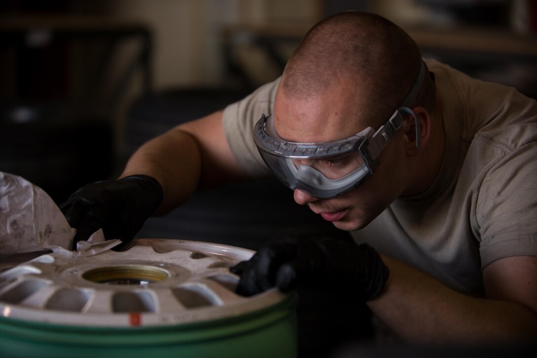 U.S. Air Force Staff Sgt. William “Willy” Reibsome III, 455th Expeditionary Maintenance Squadron wheel and tire noncommissioned officer in charge, cleans and inspects an F-16 Fighting Falcon aircraft wheel at Bagram Airfield, Afghanistan, Aug. 2, 2015. Reibsome ensures that F-16s at BAF have serviceable tires to complete the combat airpower mission; on average he works 70 wheels per month. (U.S. Air Force photo by Tech. Sgt. Joseph Swafford/Released)